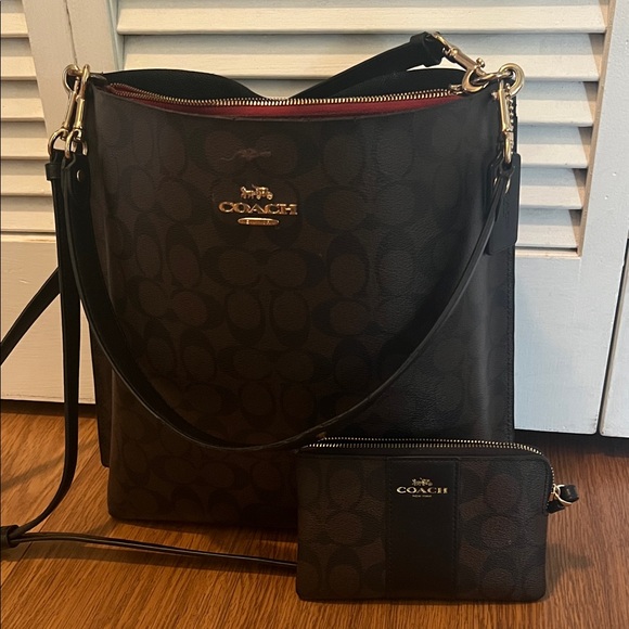 Coach Handbags - Coach dark brown and Black Crossbody and shoulder Bag 13”x12”